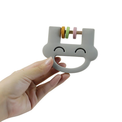 Smile Face Cute Silicone Kids Toys Silicone Rattle Teether Dengan Logo Kustomisasi OEM ODM